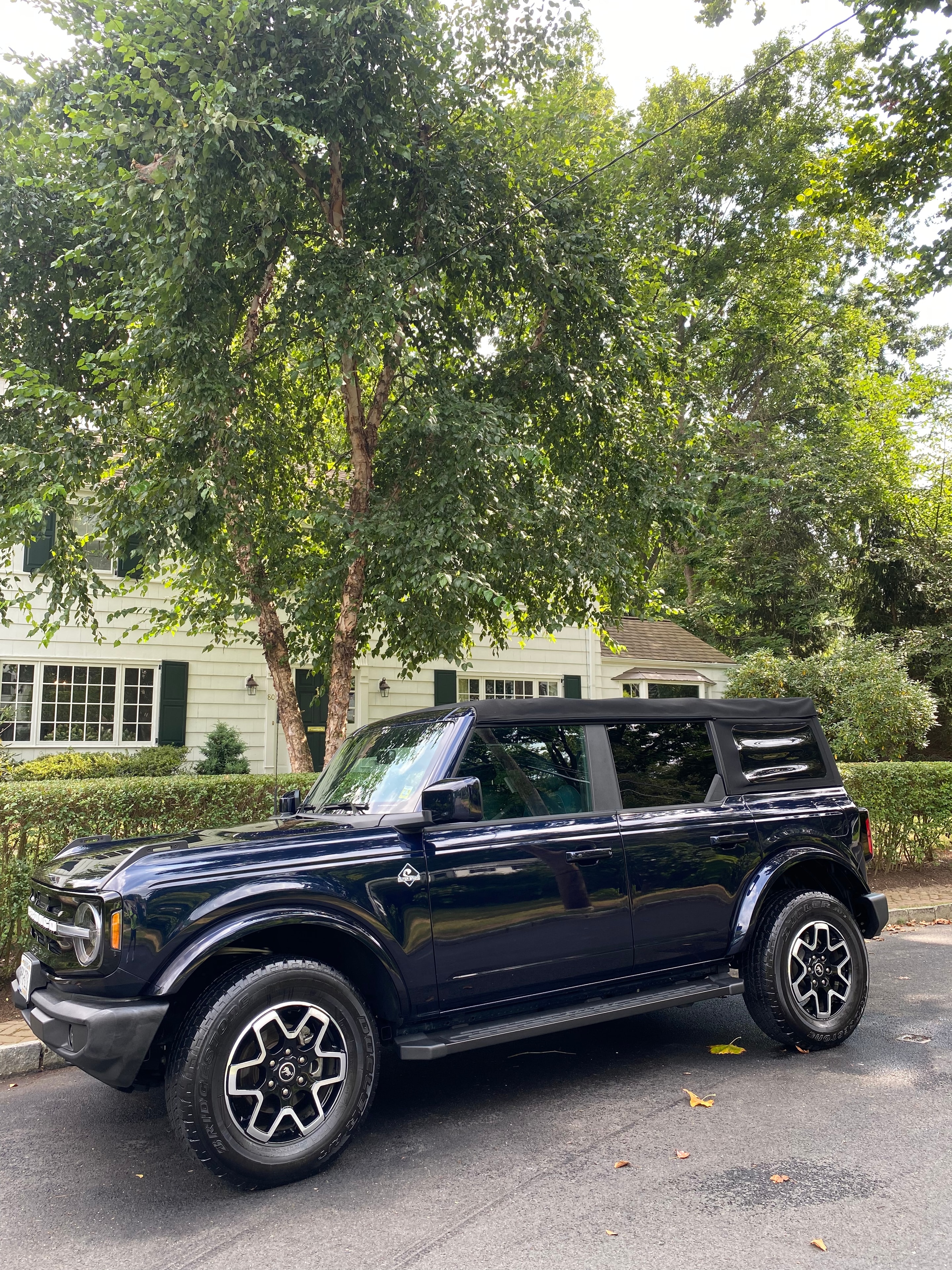 Dark SUV freshly detailed on a residential street